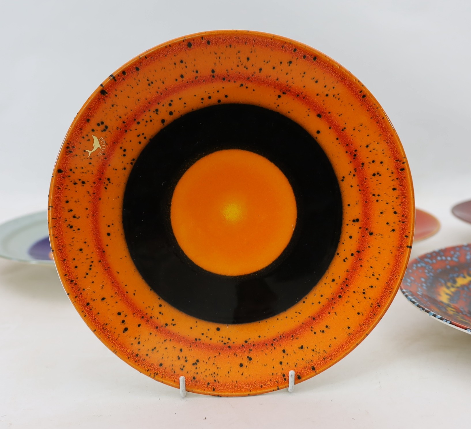 Alan Clarke for Poole Pottery. A set of nine ‘Alignment of the Planets’ chargers and one duplicate, c.2000, 26cm diameter